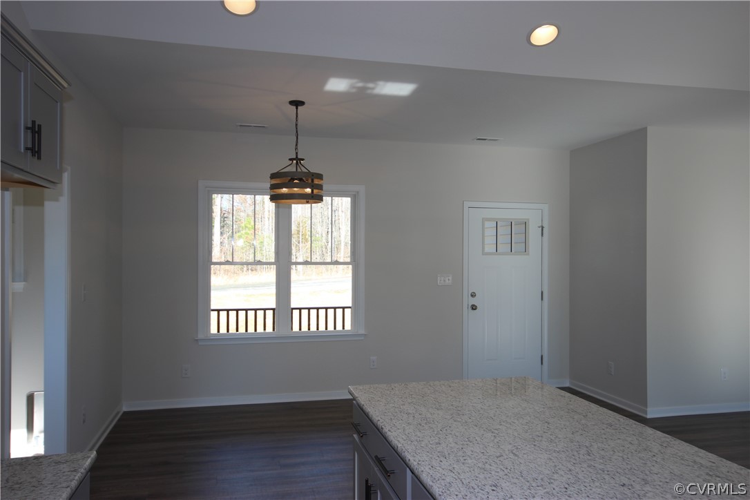 165 New S Ridge Road Bumpass, VA 23024 - Photo 10 of 26 an empty room with windows and chandelier