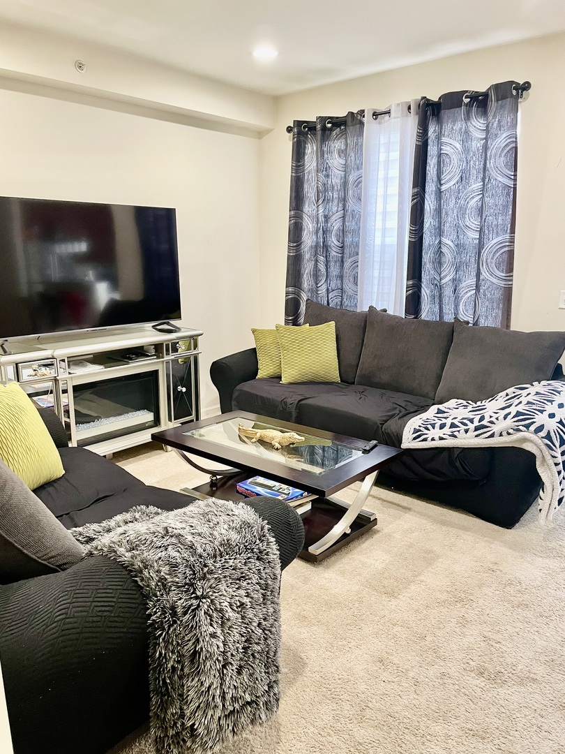 2018 Shermer Road, Unit 2018 Glenview, IL 60026 - Photo 12 of 39 a living room with furniture and a flat screen tv