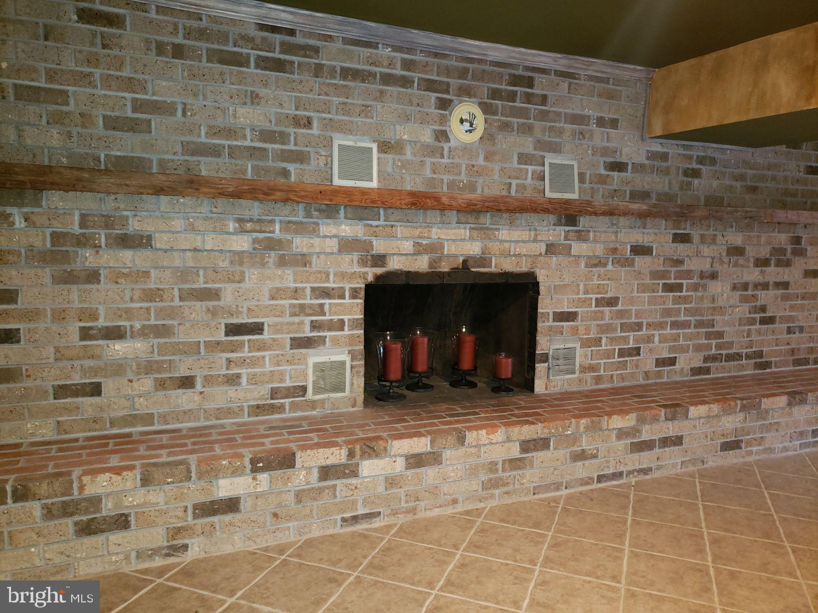 9395 Ramey Road Marshall, VA 20115 - Photo 43 of 71 Grand fireplace, tile floor with inset carpet