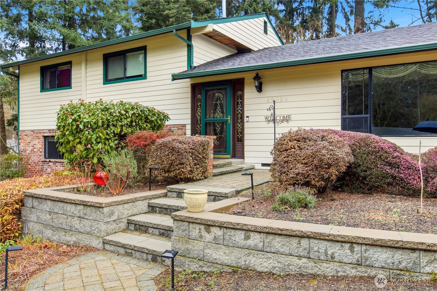 29820 6th Avenue South Federal Way, WA 98003 - Photo 1 of 40 a front view of a house with fountain