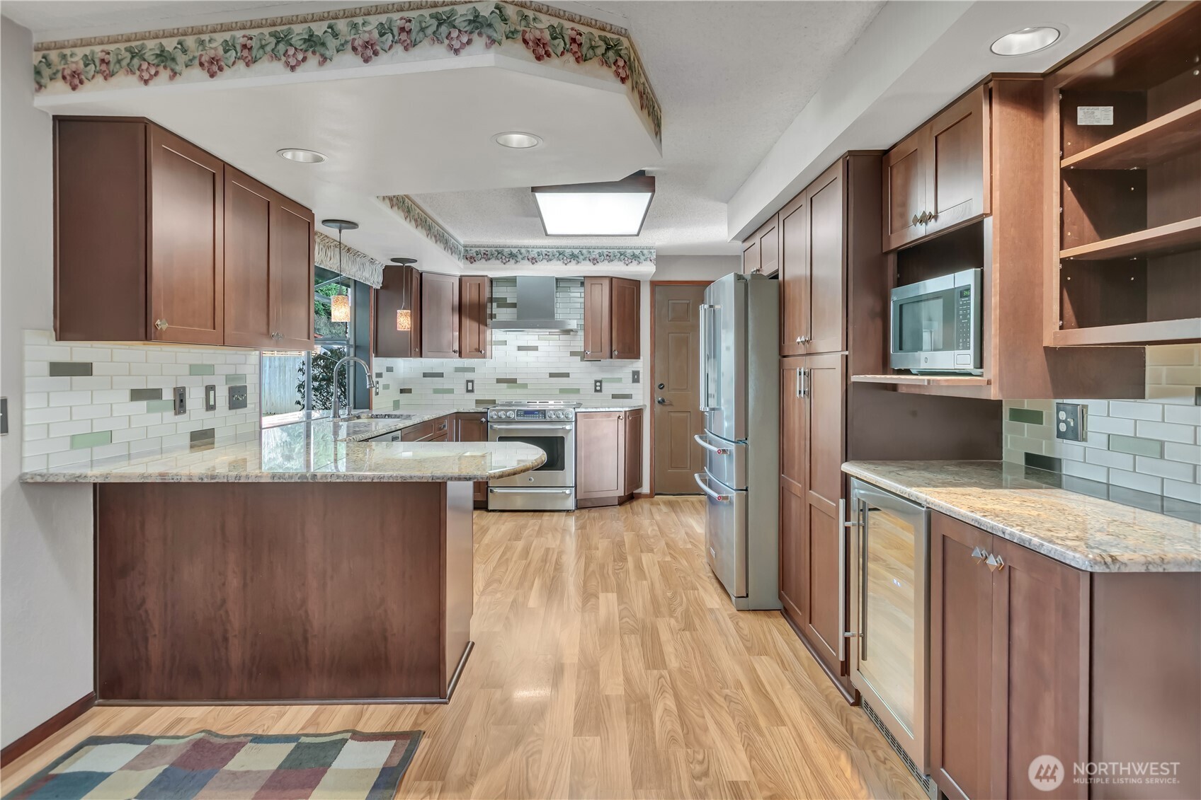 29820 6th Avenue South Federal Way, WA 98003 - Photo 11 of 40 a kitchen with stainless steel appliances granite countertop a sink stove and refrigerator