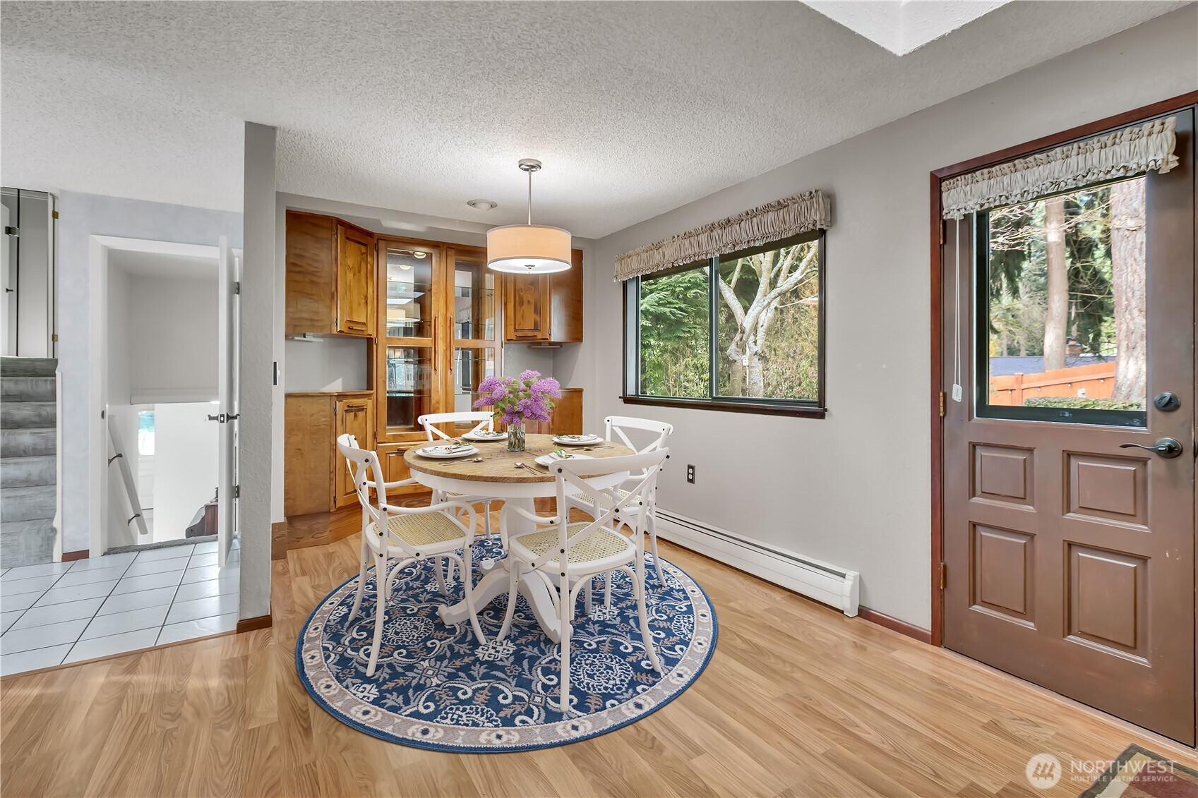 29820 6th Avenue South Federal Way, WA 98003 - Photo 12 of 40 a view of a dining room with furniture window and wooden floor