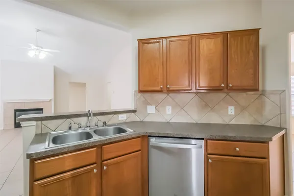 a kitchen with a sink cabinets and window