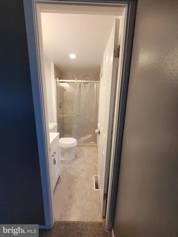 a bathroom with a glass door shower