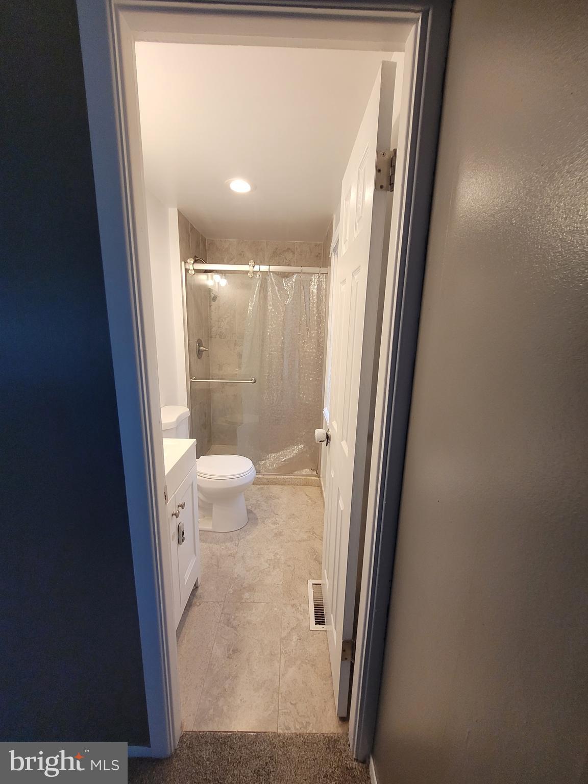 12 Hasting Lane Willingboro, NJ 08046 - Photo 3 of 12 a bathroom with a glass door shower