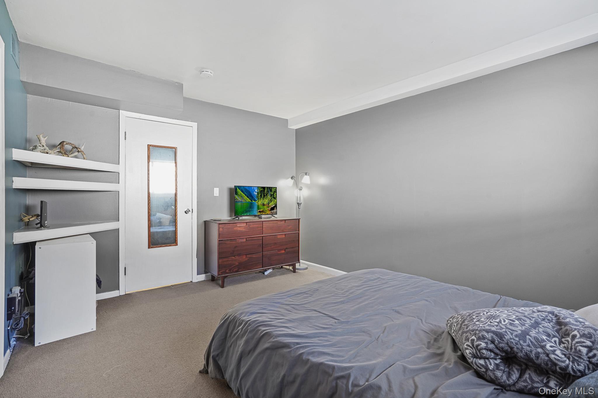 26 Cooper Road, Unit 411 Poughkeepsie, NY 12603 - Photo 12 of 17 Bedroom with carpet flooring and baseboards