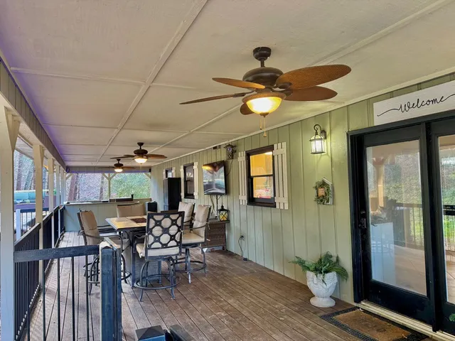 a living room with lots of furniture and a flat screen tv