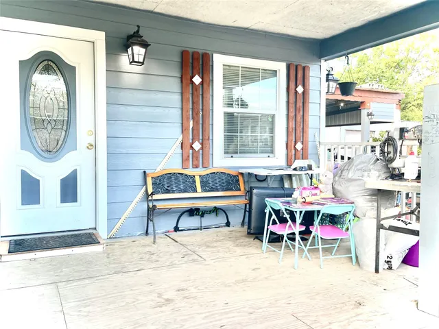 a living room filled with furniture and a wooden floor