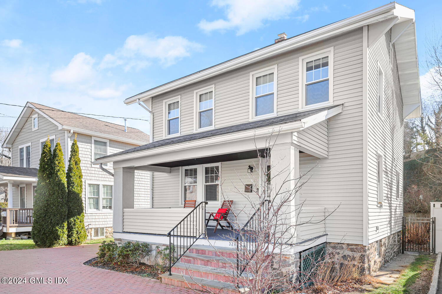 328 Delavan Avenue Greenwich, CT 06830 - Photo 1 of 29 a front view of a house with a patio