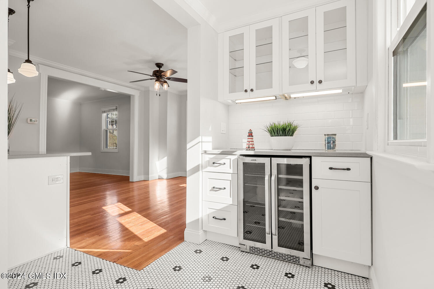 328 Delavan Avenue Greenwich, CT 06830 - Photo 15 of 29 a kitchen with white cabinets and a stove