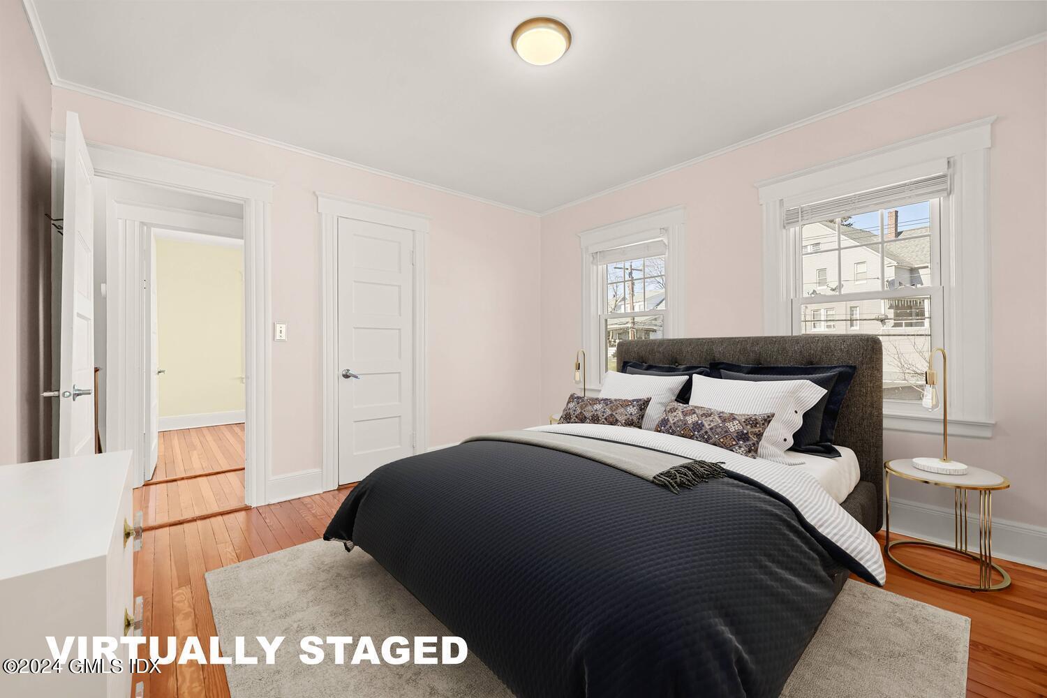 328 Delavan Avenue Greenwich, CT 06830 - Photo 18 of 29 a bedroom with a bed and a window