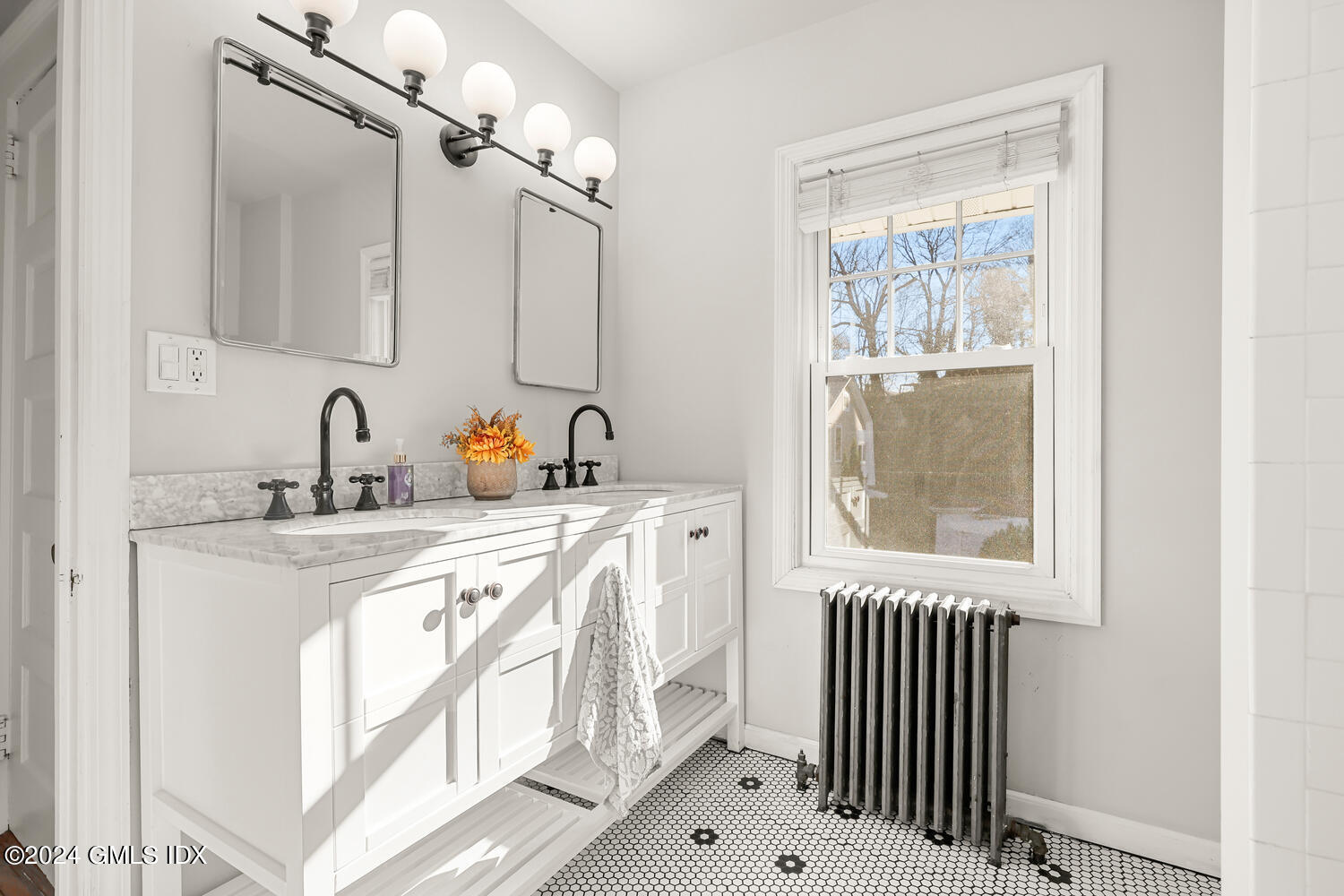 328 Delavan Avenue Greenwich, CT 06830 - Photo 21 of 29 a kitchen with a sink window and cabinets