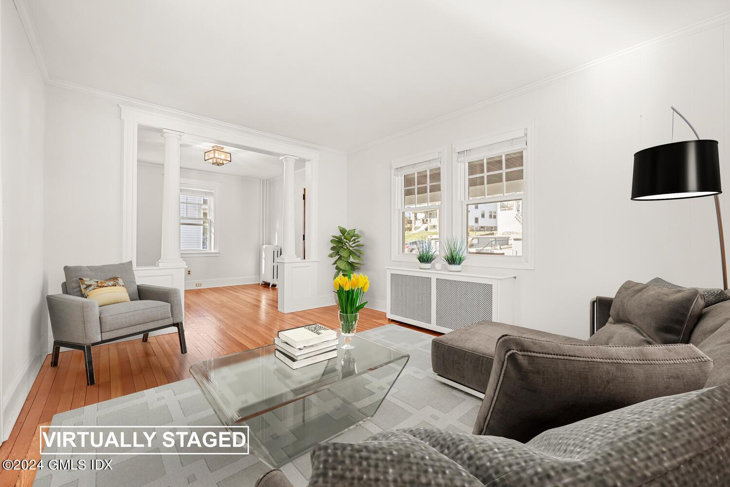 328 Delavan Avenue Greenwich, CT 06830 - Photo 7 of 29 a living room with furniture and a couch