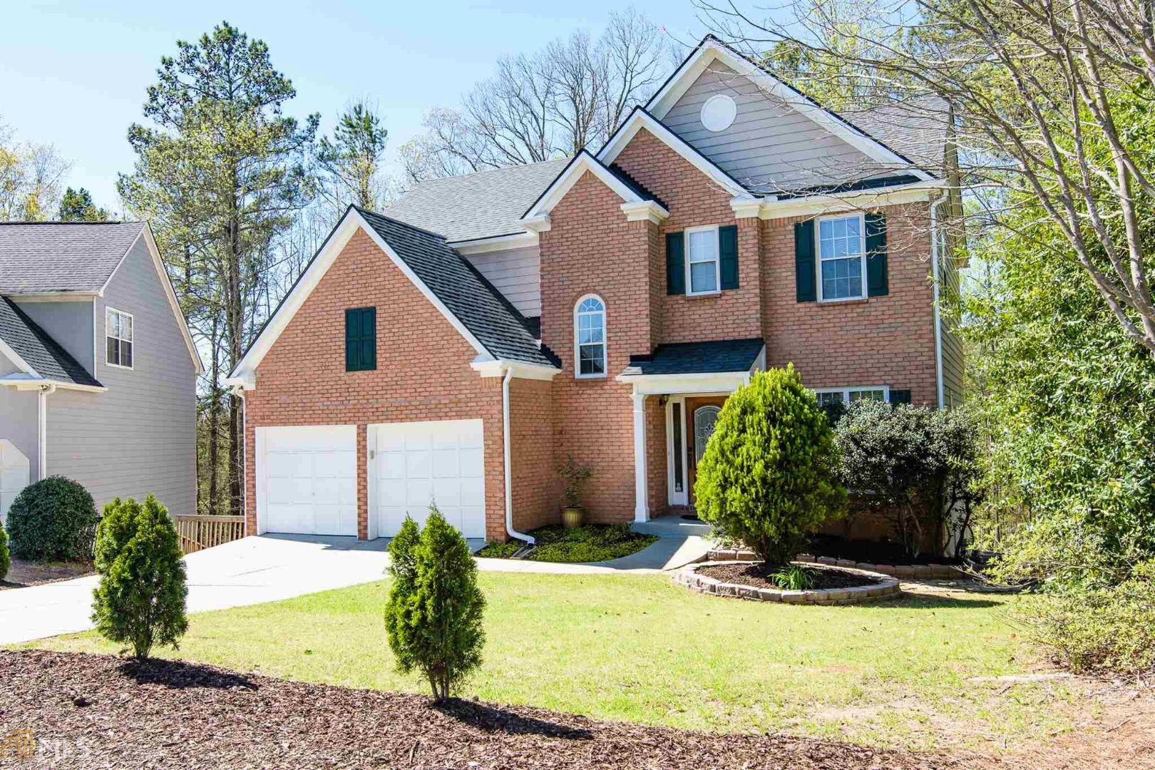 a front view of a house with a yard outdoor seating and yard
