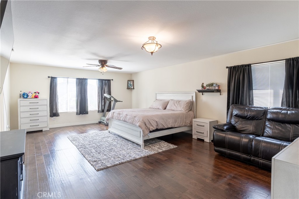 3807 Seattle Street Hemet, CA 92545 - Photo 24 of 37 a bedroom with a bed couch and a window