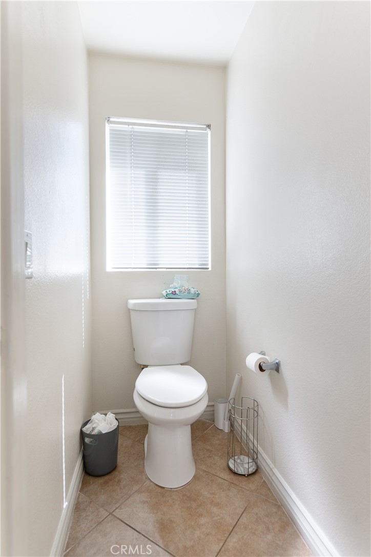 3807 Seattle Street Hemet, CA 92545 - Photo 29 of 37 a bathroom with a toilet and a sink