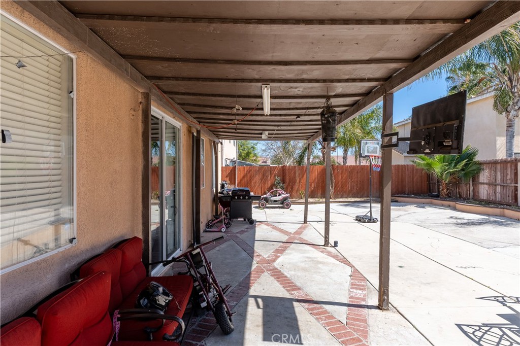 3807 Seattle Street Hemet, CA 92545 - Photo 34 of 37 a view of a chairs and table in backyard