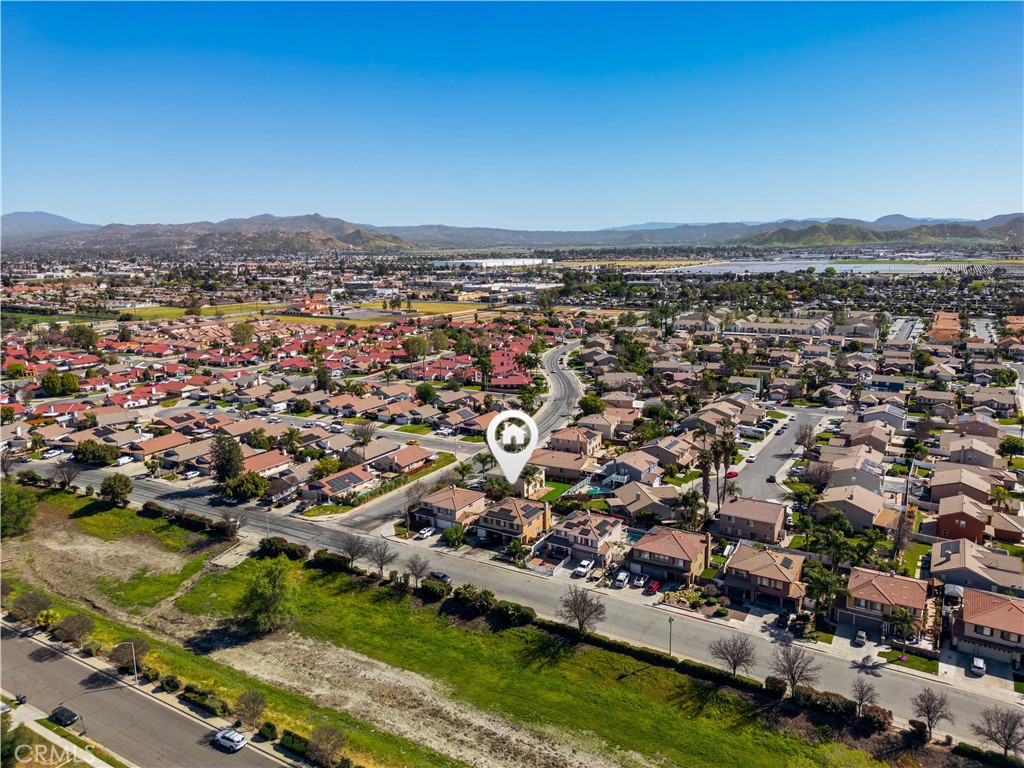 3807 Seattle Street Hemet, CA 92545 - Photo 37 of 37 an aerial view of residential houses with outdoor space and trees