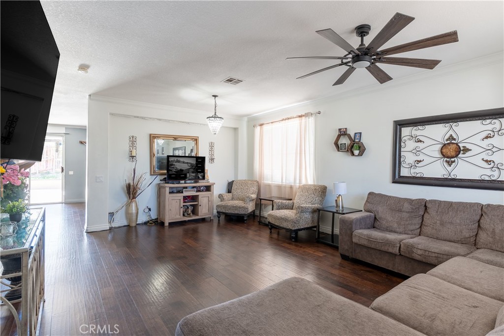 3807 Seattle Street Hemet, CA 92545 - Photo 4 of 37 a living room with furniture or couch and a flat screen tv