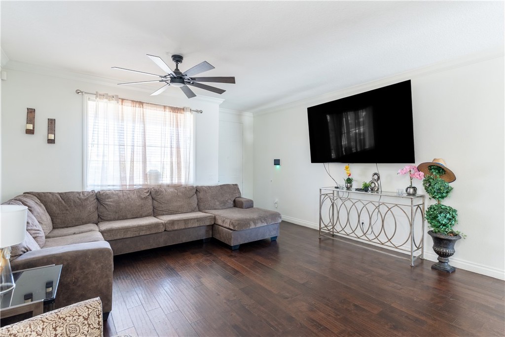 3807 Seattle Street Hemet, CA 92545 - Photo 6 of 37 a living room with furniture and a flat screen tv