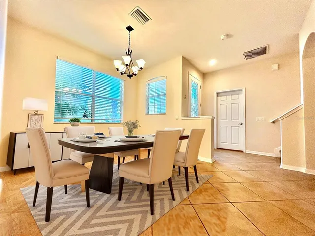 a view of a dining room with furniture window and outside view