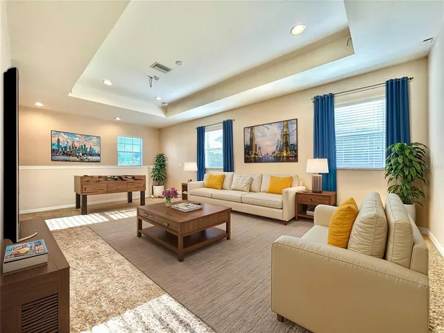 a living room with furniture and a rug