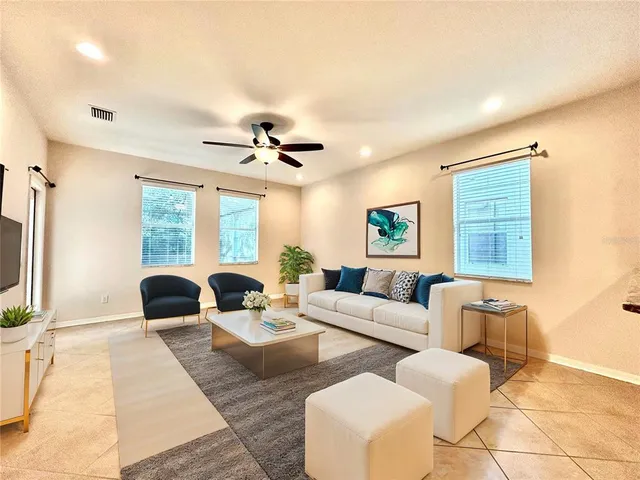 a living room with furniture and a large window