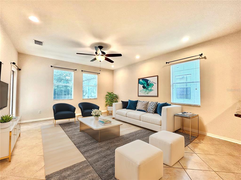 11210 Roseate Drive Tampa, FL 33626 - Photo 2 of 50 a living room with furniture and a large window
