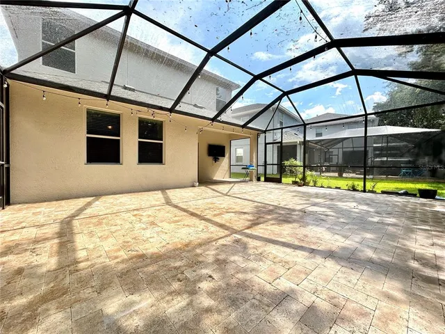 a view of a swimming pool and lounge chair