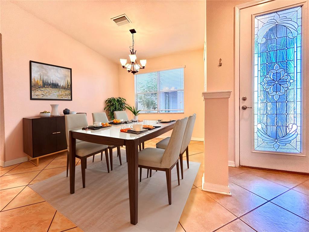 11210 Roseate Drive Tampa, FL 33626 - Photo 9 of 50 a dining room with furniture and window