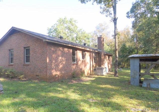 915 West Rambo Road Rock Hill, SC 29730 - Photo 12 of 14 a backyard of a house with table and chairs