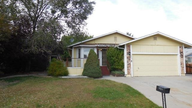 3035 Achilles Drive Reno, NV 89512 - Photo 1 of 1 a front view of a house with a garden