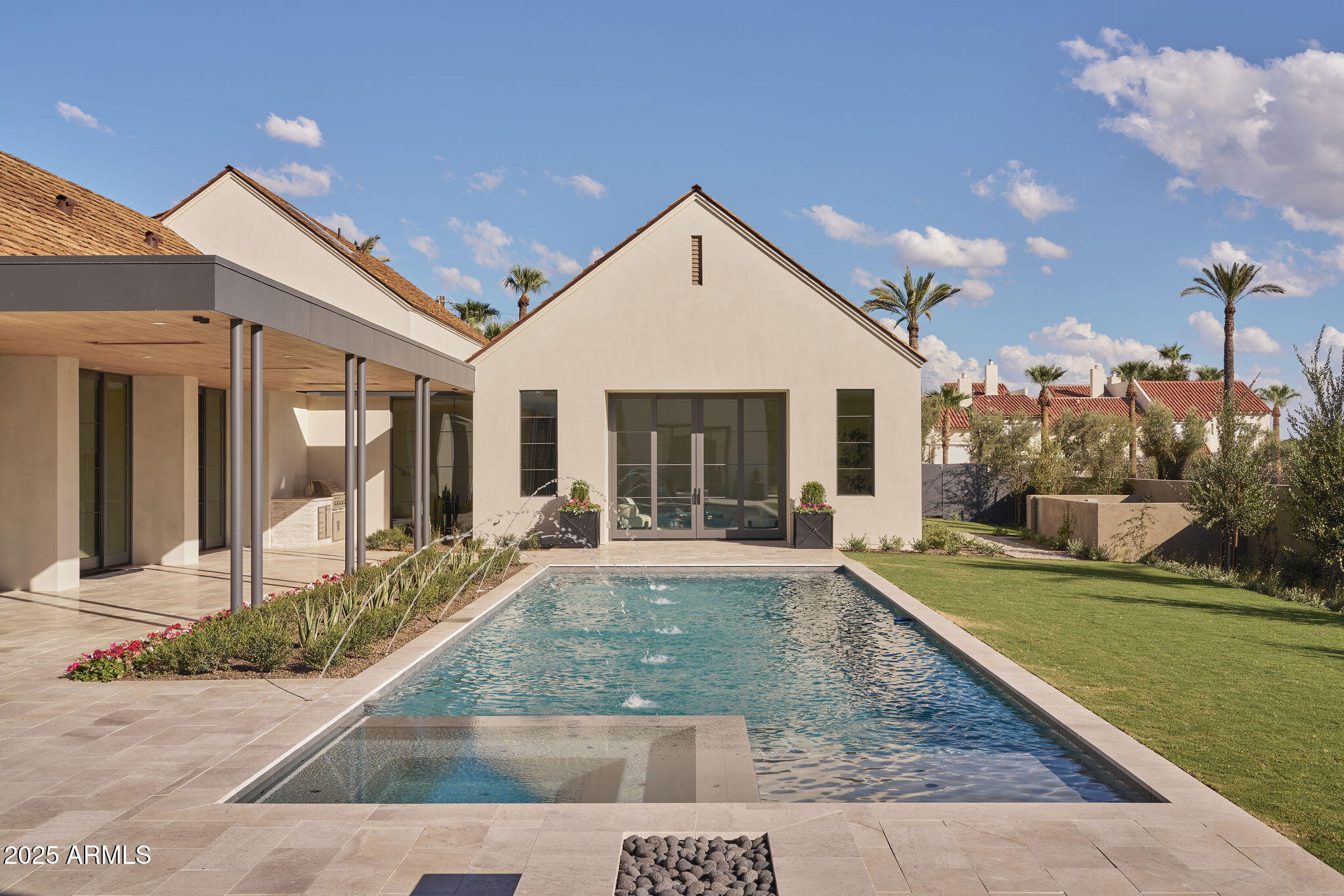 a view of a house with sitting area and garden