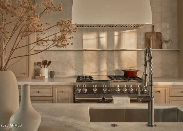 a kitchen with a sink and large window