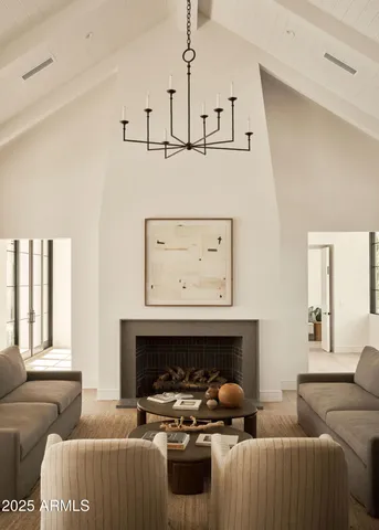 a living room with furniture a fireplace and window