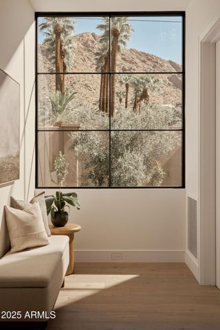 a hallway with with cabinets and a couch
