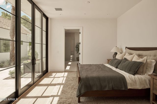 a bedroom with a bed and a couch