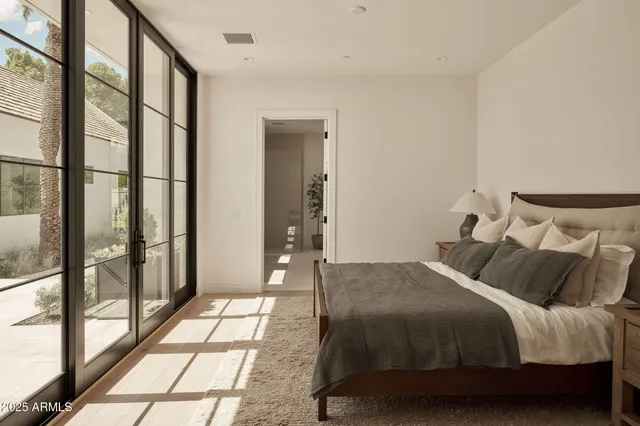 a bedroom with a bed and a couch