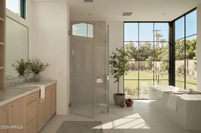 a vase of flowers sitting on a granite counter top