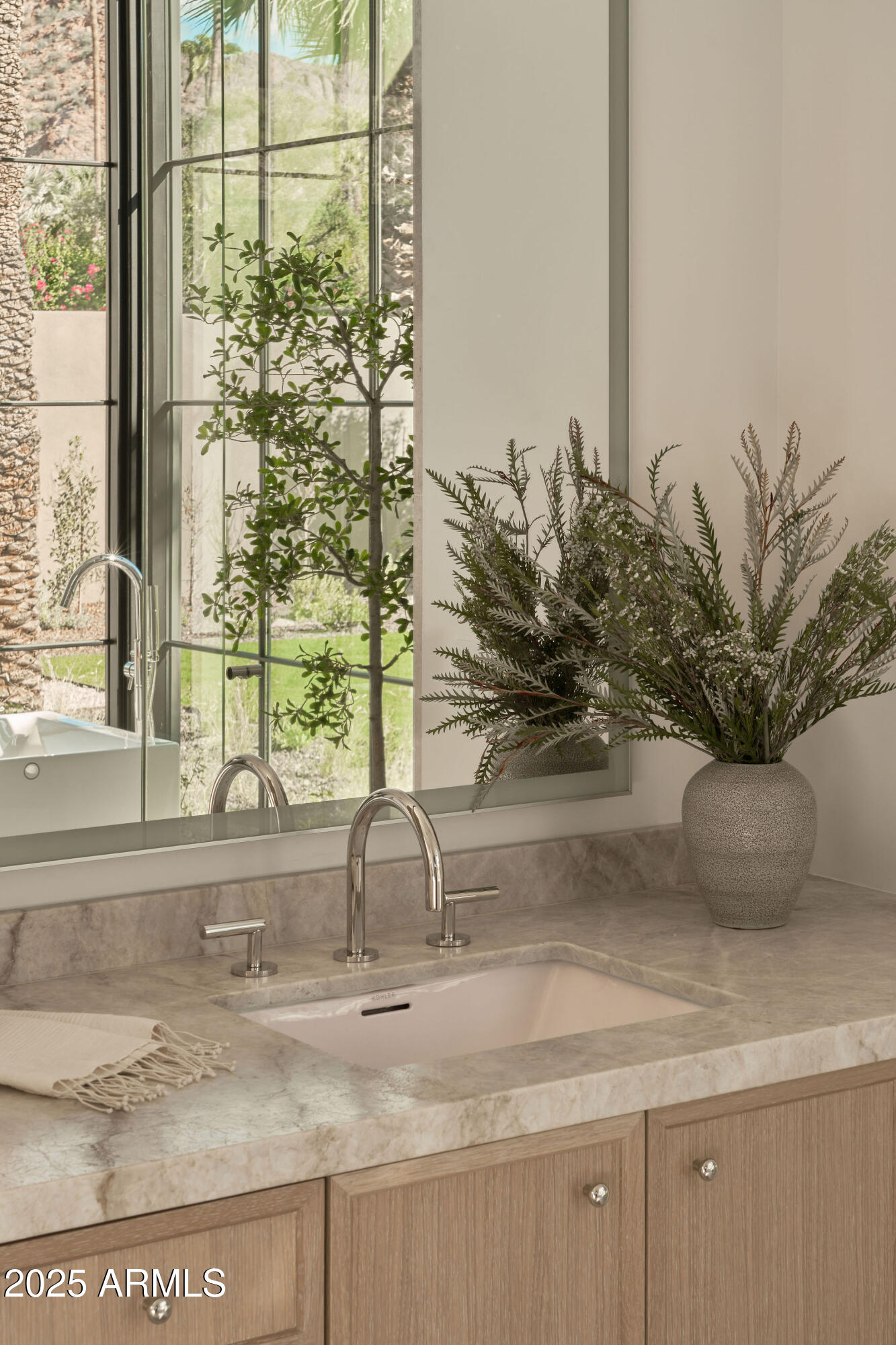 4600 North Rubicon Avenue, Unit 2 Phoenix, AZ 85018 - Photo 22 of 53 a vase of flowers sitting on a granite counter top