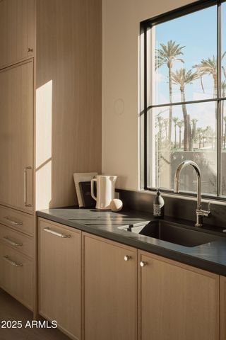 a view of a room with furniture and windows