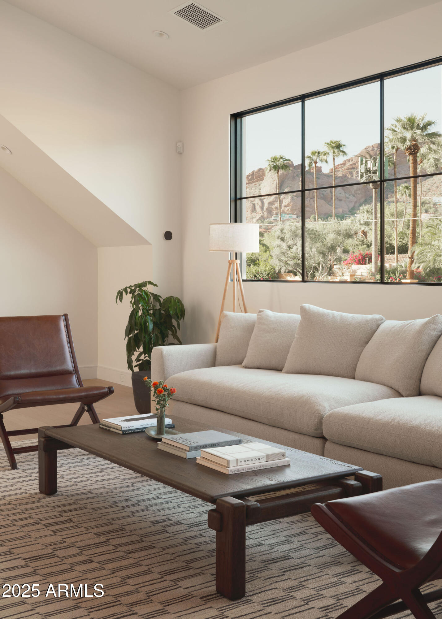 4600 North Rubicon Avenue, Unit 2 Phoenix, AZ 85018 - Photo 35 of 53 a living room with furniture and a floor to ceiling window