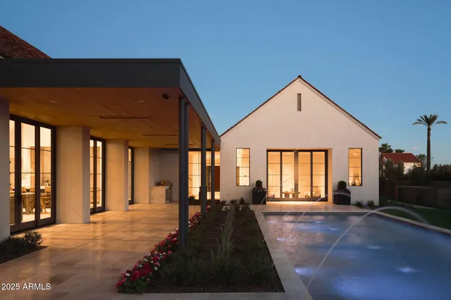 a view of a house with a small yard and plants