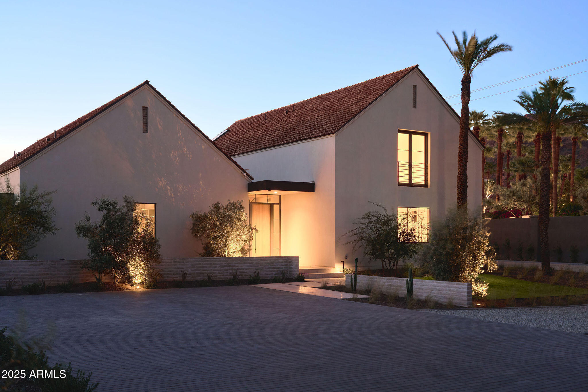 4600 North Rubicon Avenue, Unit 2 Phoenix, AZ 85018 - Photo 50 of 53 a front view of a house with a yard and garage
