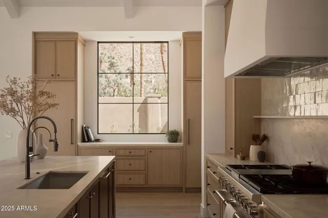 a kitchen with lots of counter top space and appliances