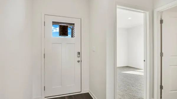 a view of a small space with wooden floor