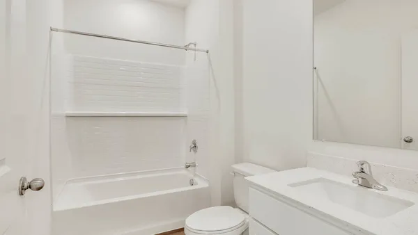 a bathroom with a sink toilet and bathtub