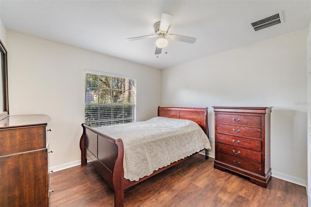 12204 Luftburrow Lane Hudson, FL 34669 - Photo 24 of 33 a bedroom with a bed and a window