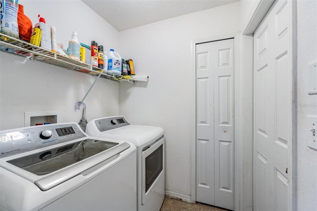 12204 Luftburrow Lane Hudson, FL 34669 - Photo 28 of 33 a utility room with dryer and washer
