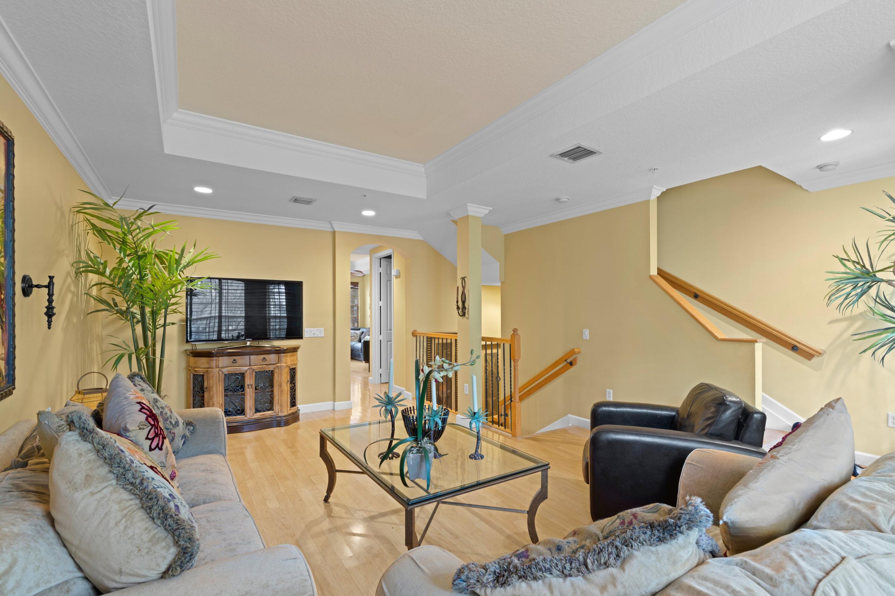 2714 Ravella Way Palm Beach Gardens, FL 33410 - Photo 11 of 27 Living Room and Stairs to 3rd Fl